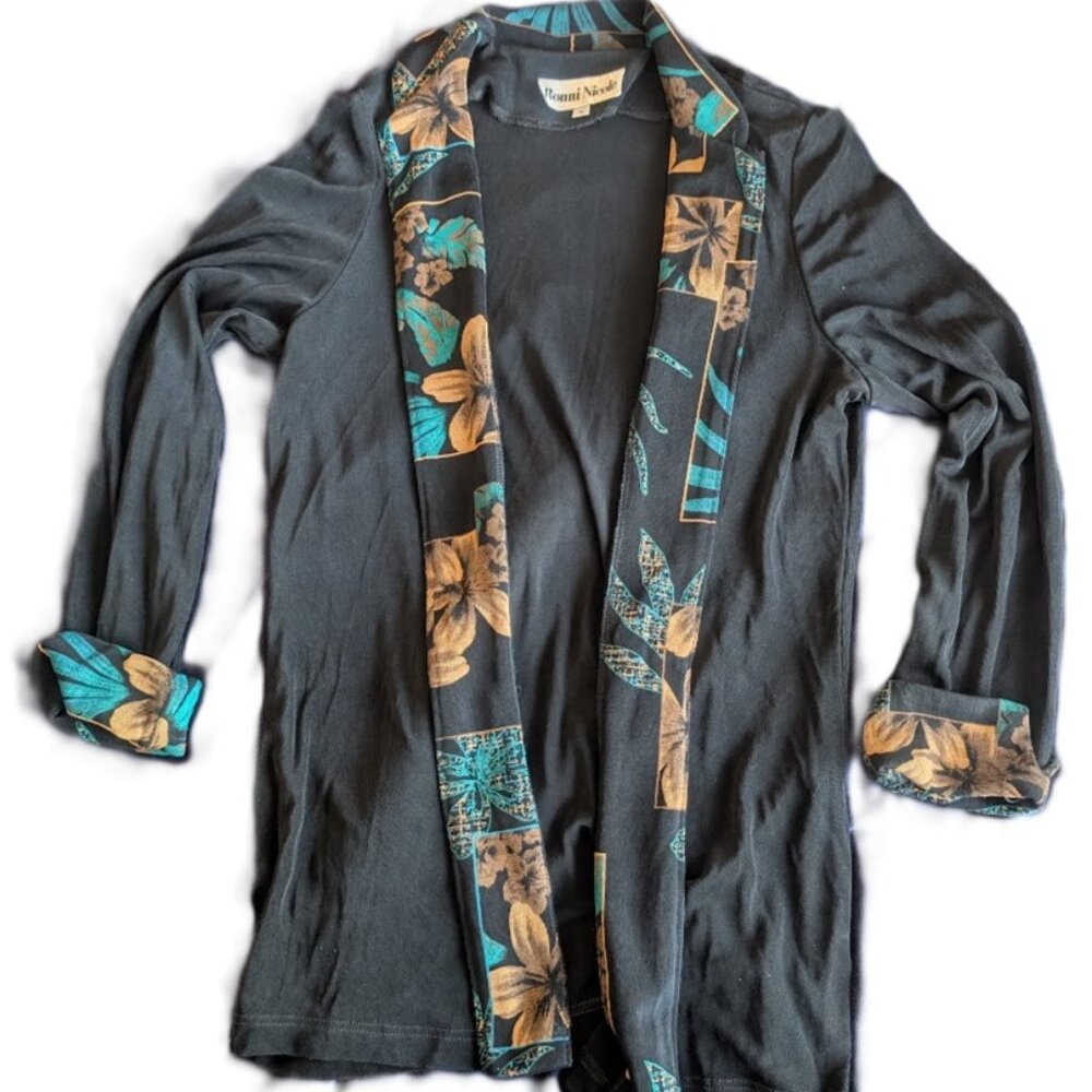 Flowy black jacket with patterned labels/cuffs. by Ronni Nicole